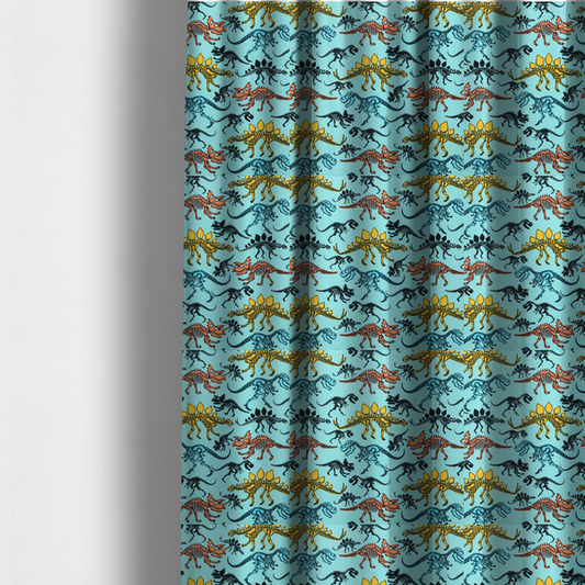 The fabric used to create these made-to-measure curtains is a repeating pattern on a light blue background featuring colourful dinosaur skeletons in yellow, orange, blue, and black, depicting various species including Stegosaurus, Triceratops, and Tyrannosaurus rex.