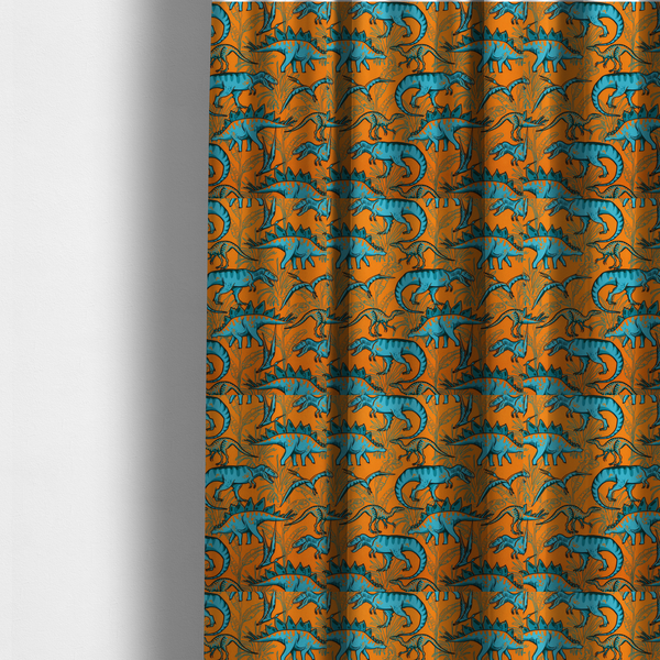 The fabric used to create these made-to-measure curtains is a repeating pattern on a bright orange background featuring blue dinosaurs, including Stegosaurus, T-Rex, and pterosaurs, set against a backdrop of palm leaves and tropical foliage.