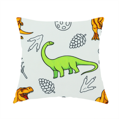 The fabric used to create this handmade cushion is a repeating pattern on a light grey-blue background featuring orange Tyrannosaurus rex dinosaurs, a bright green long-necked sauropod, speckled dinosaur eggs, pinecones, footprints, and leafy sprigs.