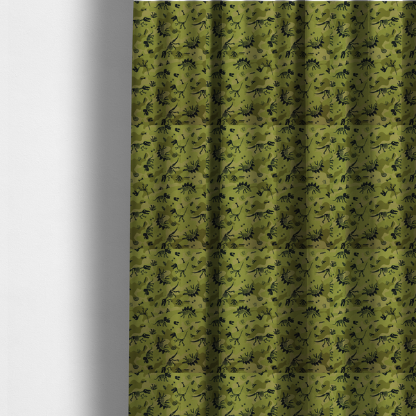 The fabric used to create these made-to-measure curtains is a military-style green camouflage pattern featuring repeating black dinosaur skeletons, bones, footprints, and fossils.