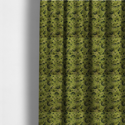 The fabric used to create these made-to-measure curtains is a military-style green camouflage pattern featuring repeating black dinosaur skeletons, bones, footprints, and fossils.