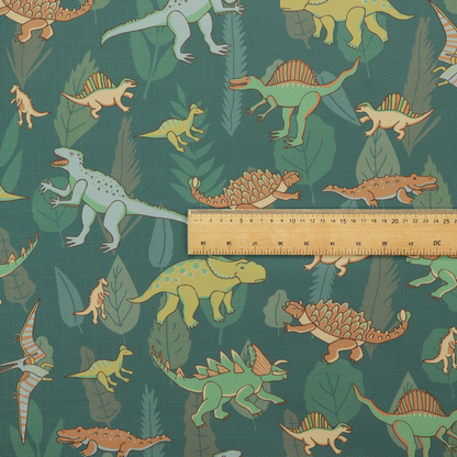 A playful dinosaur pattern on a deep teal background featuring various illustrated dinosaurs and lush tropical leaves.