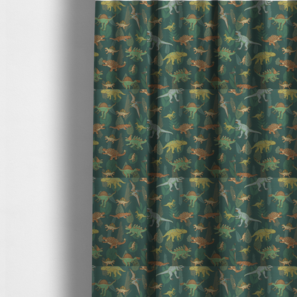 The fabric used to create these made-to-measure curtains is a playful dinosaur pattern on a deep teal background featuring various illustrated dinosaurs and lush tropical leaves.