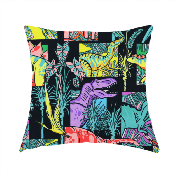 The fabric used to create this handmade cushion is a bold repeating pattern on a black background featuring colourful dinosaurs, including pink, yellow, teal, and purple species, framed within geometric panels and surrounded by tropical foliage.