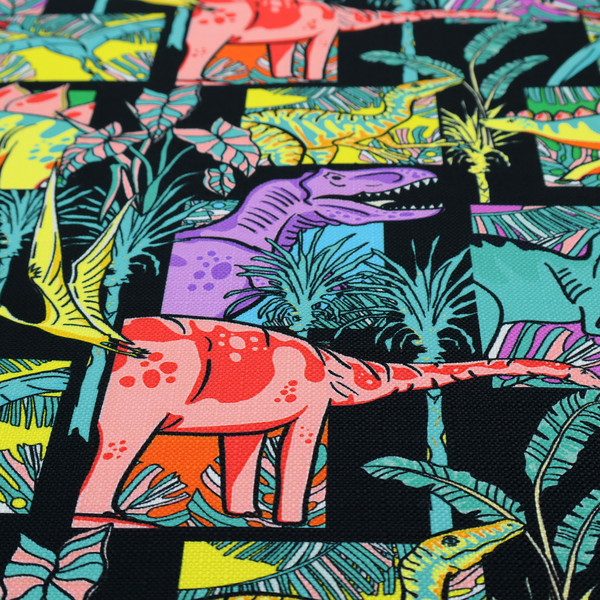 A bold repeating pattern on a black background featuring colourful dinosaurs, including pink, yellow, teal, and purple species, framed within geometric panels and surrounded by tropical foliage.