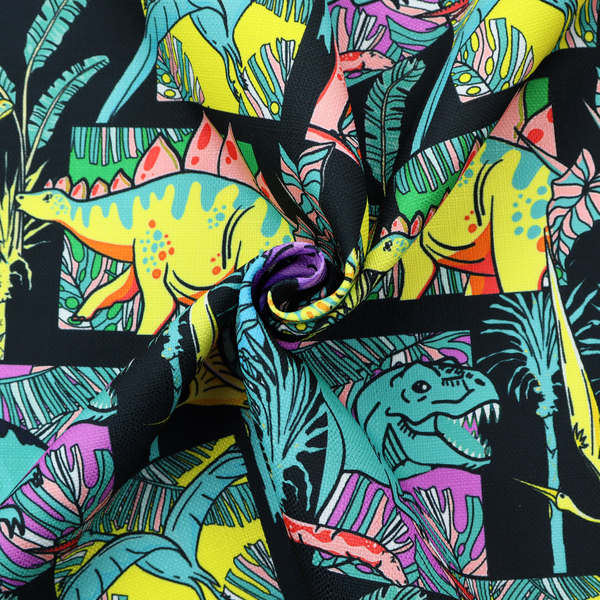 A bold repeating pattern on a black background featuring colourful dinosaurs, including pink, yellow, teal, and purple species, framed within geometric panels and surrounded by tropical foliage.