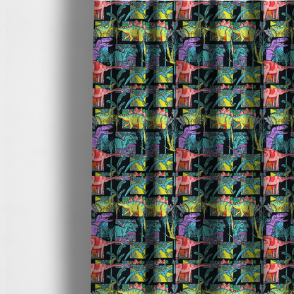 The fabric used to create these made-to-measure curtains is a bold repeating pattern on a black background featuring colourful dinosaurs, including pink, yellow, teal, and purple species, framed within geometric panels and surrounded by tropical foliage.