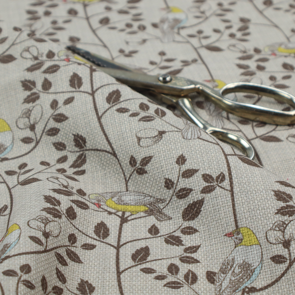 Vintage-style botanical fabric featuring yellow-bellied songbirds perched on climbing brown vines and rosebuds against a textured grey background.