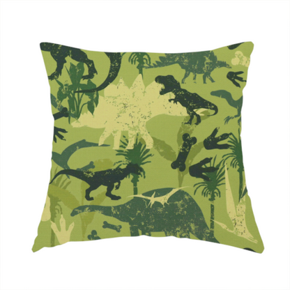 The fabric used to create this handmade cushion is a textured, distressed green and olive camouflage pattern featuring repeating silhouettes of dinosaurs, bones, footprints, and palm fronds.