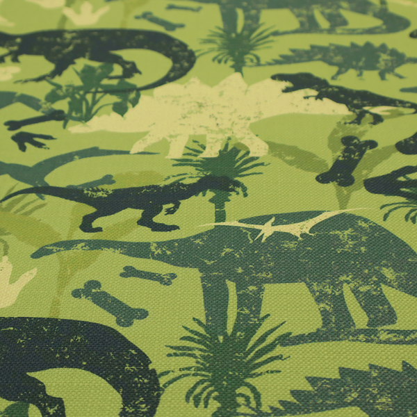 A textured, distressed green and olive camouflage pattern featuring repeating silhouettes of dinosaurs, bones, footprints, and palm fronds.