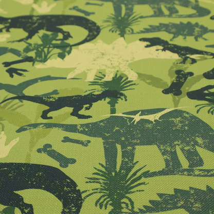 A textured, distressed green and olive camouflage pattern featuring repeating silhouettes of dinosaurs, bones, footprints, and palm fronds.