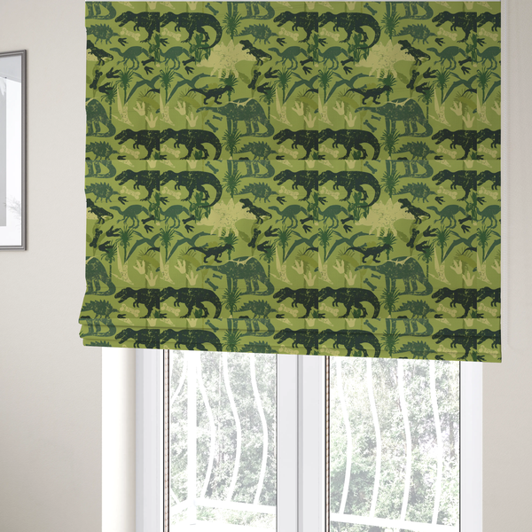 The fabric used to create these Roman blinds is a textured, distressed green and olive camouflage pattern featuring repeating silhouettes of dinosaurs, bones, footprints, and palm fronds.