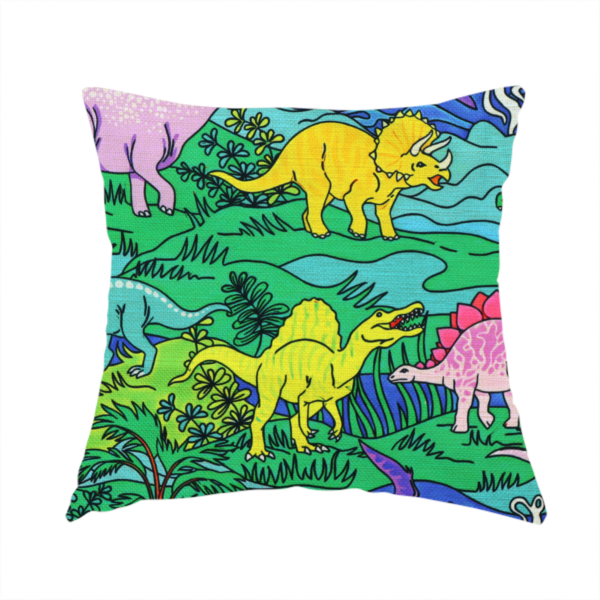 The fabric used to create this handmade cushion is a vibrant, colourful repeating pattern featuring various cartoon dinosaurs including a pink long-neck, yellow triceratops, green T-Rex, and flying pterodactyls amidst a prehistoric landscape.