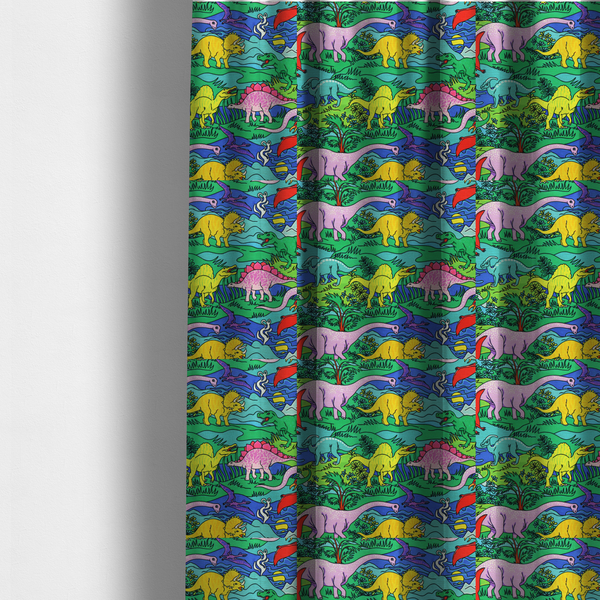 The fabric used to create these made-to-measure curtains is a vibrant, colourful repeating pattern featuring various cartoon dinosaurs including a pink long-neck, yellow triceratops, green T-Rex, and flying pterodactyls amidst a prehistoric landscape.