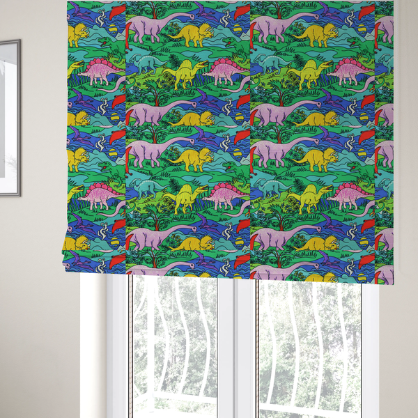 The fabric used to create these Roman blinds is a vibrant, colourful repeating pattern featuring various cartoon dinosaurs including a pink long-neck, yellow triceratops, green T-Rex, and flying pterodactyls amidst a prehistoric landscape.
