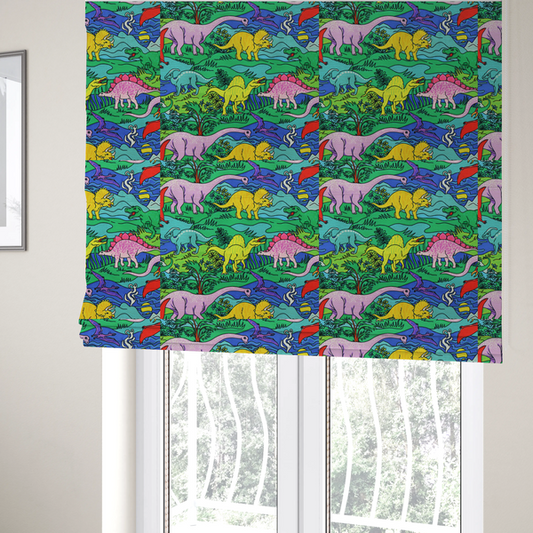 The fabric used to create these Roman blinds is a vibrant, colourful repeating pattern featuring various cartoon dinosaurs including a pink long-neck, yellow triceratops, green T-Rex, and flying pterodactyls amidst a prehistoric landscape.