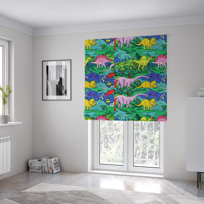 The fabric used to create these Roman blinds is a vibrant, colourful repeating pattern featuring various cartoon dinosaurs including a pink long-neck, yellow triceratops, green T-Rex, and flying pterodactyls amidst a prehistoric landscape.