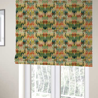 The fabric used to create these Roman blinds is a seamless geometric upholstery fabric pattern featuring an intricate, symmetrical Aztec-inspired motif of interlocking diamonds and vertical zigzags in earthy tones of green, rust, mustard yellow, and peach.