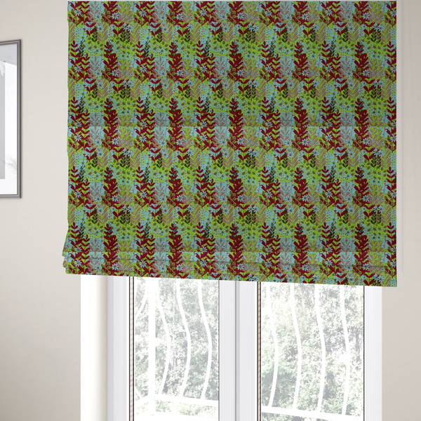The fabric used to create these Roman blinds is a dense, seamless repeating botanical pattern featuring an array of stylized leaves, foliage, and small blue flowers set against a bright lime green background. The various plant elements are rendered in shades of deep red, mauve, dark brown, and pale blue.