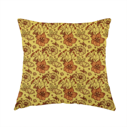 The fabric used to create this handmade cushion is a seamless repeating botanical pattern featuring line-drawn flowers and foliage in shades of brown and burnt orange, set against a mustard yellow or gold background. The design includes clustered blossoms, delicate branching stems, and leafy elements arranged in a consistent layout.