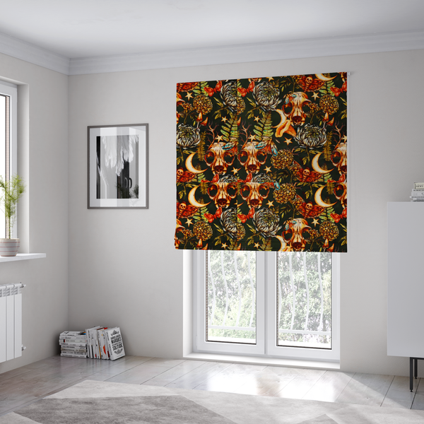 The fabric used to create these Roman blinds is a dark and mystical repeating pattern featuring animal skulls, crescent moons, stars, moths, ferns, and chrysanthemums in warm golden and orange tones.
