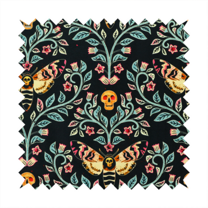 A symmetrical, damask-style repeating pattern on a black background featuring death's-head hawkmoths, human skulls, and ornate scrolling blue-green vines with pink and red flowers.