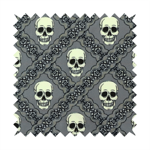 A repeating pattern on a grey background featuring off-white human skulls arranged in a grid, separated by diagonal intersecting bands of ornate black lace with intricate scrollwork.