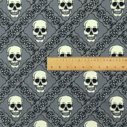 A repeating pattern on a grey background featuring off-white human skulls arranged in a grid, separated by diagonal intersecting bands of ornate black lace with intricate scrollwork.