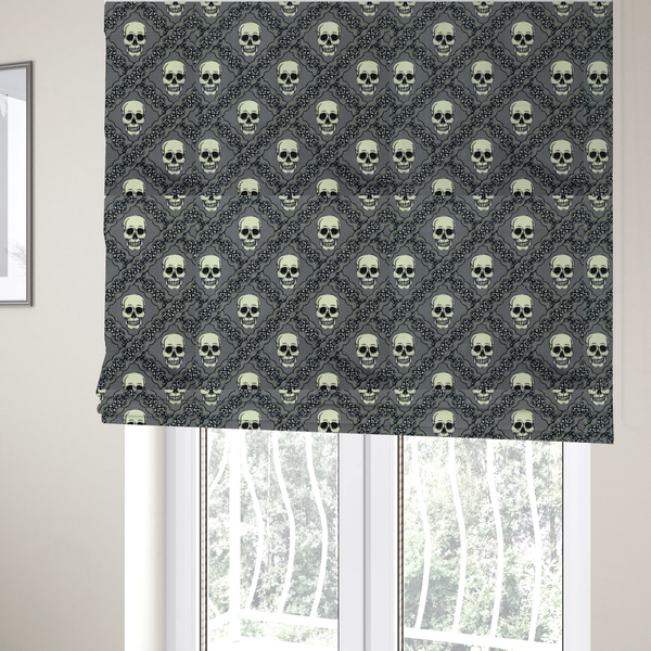 The fabric used to create these Roman blinds is a repeating pattern on a grey background featuring off-white human skulls arranged in a grid, separated by diagonal intersecting bands of ornate black lace with intricate scrollwork.