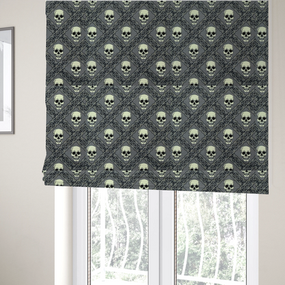 The fabric used to create these Roman blinds is a repeating pattern on a grey background featuring off-white human skulls arranged in a grid, separated by diagonal intersecting bands of ornate black lace with intricate scrollwork.