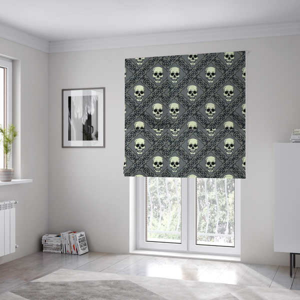 The fabric used to create these Roman blinds is a repeating pattern on a grey background featuring off-white human skulls arranged in a grid, separated by diagonal intersecting bands of ornate black lace with intricate scrollwork.