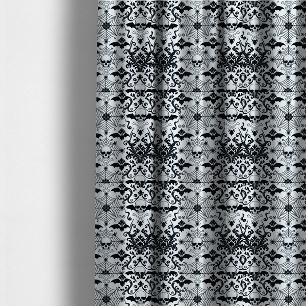 The fabric used to create these made-to-measure curtains is a spooky, ornate damask-style repeating pattern on a white background featuring black skulls, bats, spiderwebs with small spiders, and crossbones.