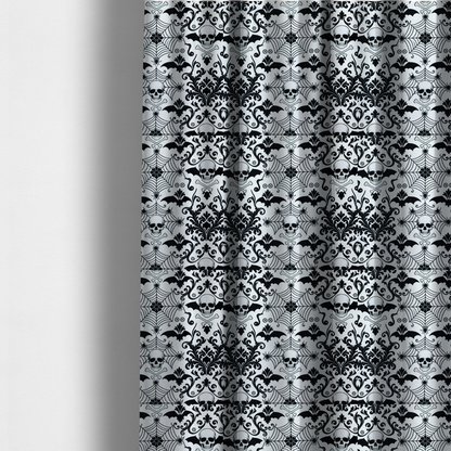 The fabric used to create these made-to-measure curtains is a spooky, ornate damask-style repeating pattern on a white background featuring black skulls, bats, spiderwebs with small spiders, and crossbones.