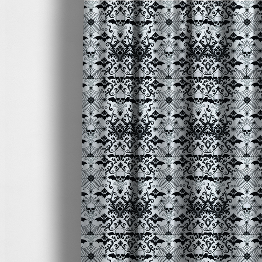 The fabric used to create these made-to-measure curtains is a spooky, ornate damask-style repeating pattern on a white background featuring black skulls, bats, spiderwebs with small spiders, and crossbones.