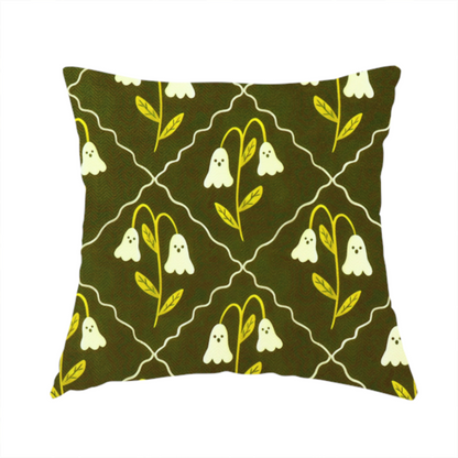 The fabric used to create this handmade cushion is a dark olive-green vintage-style pattern featuring an ogee trellis grid framing whimsical, ghost-like floral blossoms with tiny faces.