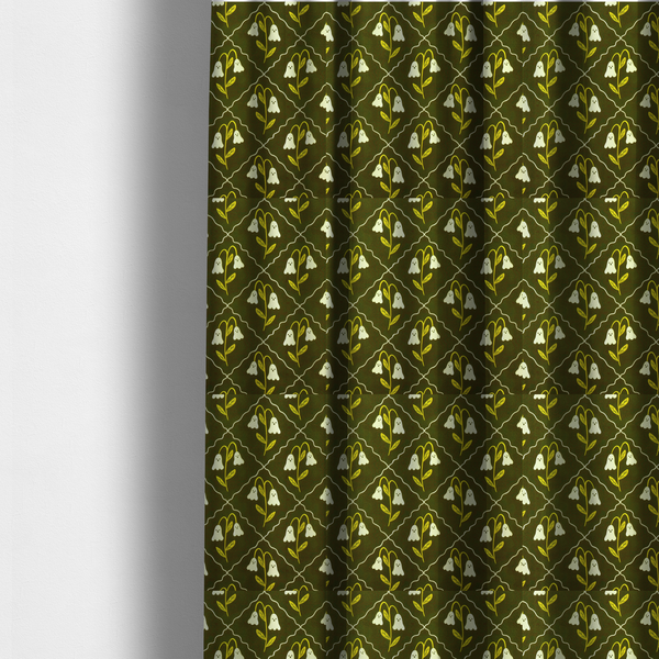The fabric used to create these made-to-measure curtains is a dark olive-green vintage-style pattern featuring an ogee trellis grid framing whimsical, ghost-like floral blossoms with tiny faces.