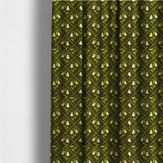 The fabric used to create these made-to-measure curtains is a dark olive-green vintage-style pattern featuring an ogee trellis grid framing whimsical, ghost-like floral blossoms with tiny faces.