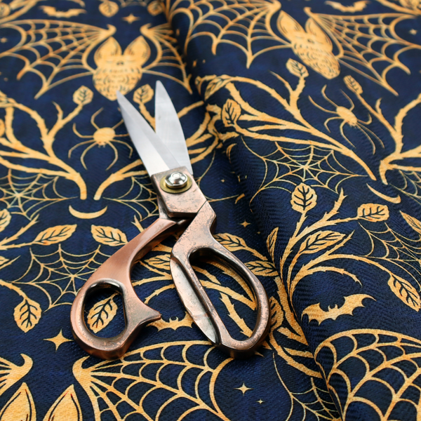 A dark navy blue gothic damask pattern featuring golden yellow bats with webbed wings, intricate spiderwebs, spiders, and twisting branches with leaves.
