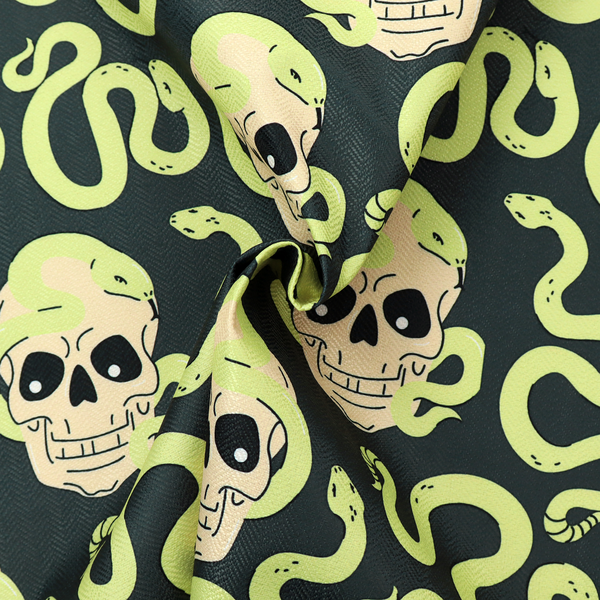 A dark charcoal pattern featuring glowing light green snakes slithering around and coiling through off-white human skulls.