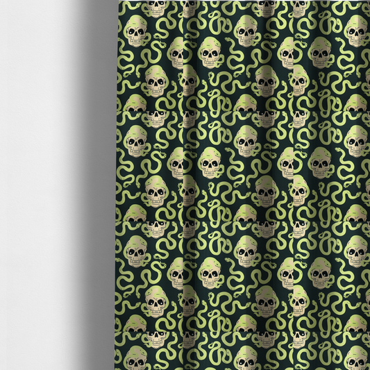 The fabric used to create these made-to-measure curtains is a dark charcoal pattern featuring glowing light green snakes slithering around and coiling through off-white human skulls.