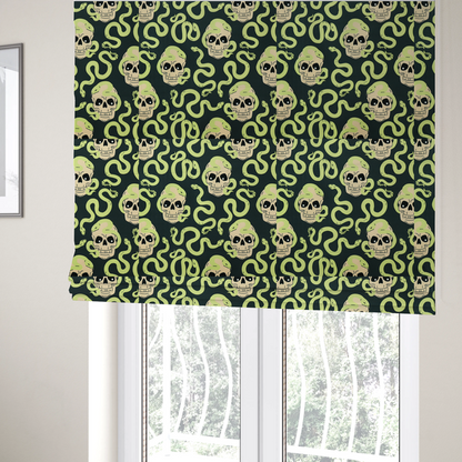 The fabric used to create these Roman blinds is a dark charcoal pattern featuring glowing light green snakes slithering around and coiling through off-white human skulls.