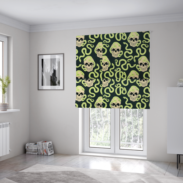The fabric used to create these Roman blinds is a dark charcoal pattern featuring glowing light green snakes slithering around and coiling through off-white human skulls.