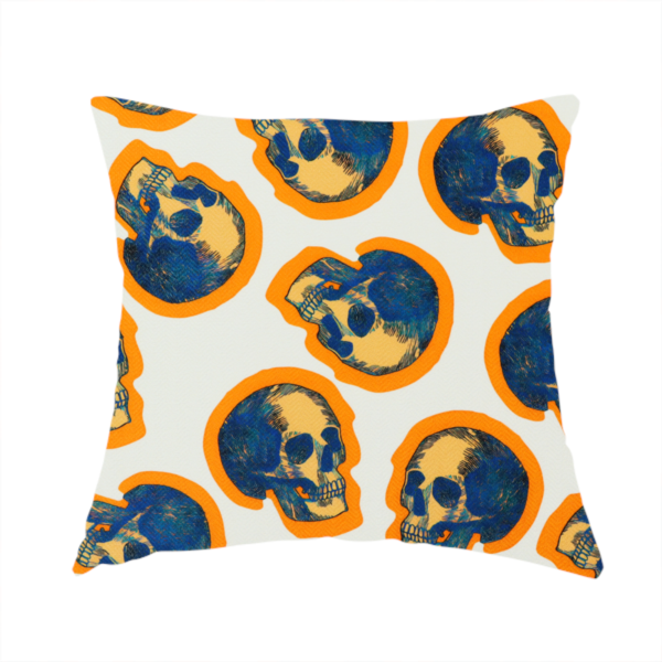 The fabric used to create this handmade cushion is a repeating pattern on an off-white background featuring distressed blue and yellow human skulls outlined in bright orange.