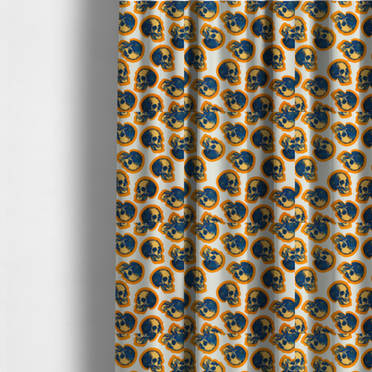 The fabric used to create these made-to-measure curtains is a repeating pattern on an off-white background featuring distressed blue and yellow human skulls outlined in bright orange.