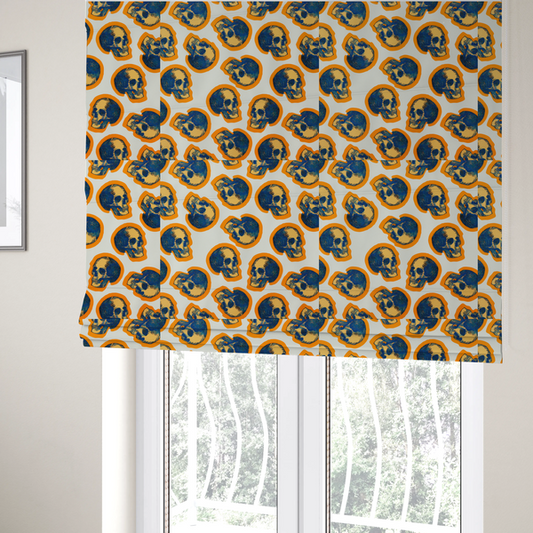 The fabric used to create these Roman blinds is a repeating pattern on an off-white background featuring distressed blue and yellow human skulls outlined in bright orange.