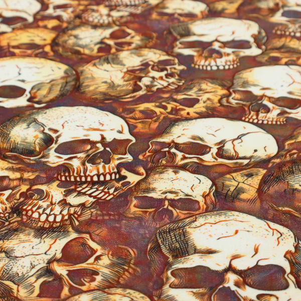 A dense, overlapping pattern of detailed vintage anatomical human skulls in shades of off-white and brown against a moody, textured rust-red background.