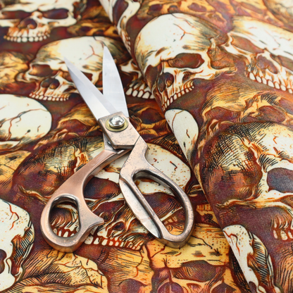 A dense, overlapping pattern of detailed vintage anatomical human skulls in shades of off-white and brown against a moody, textured rust-red background.
