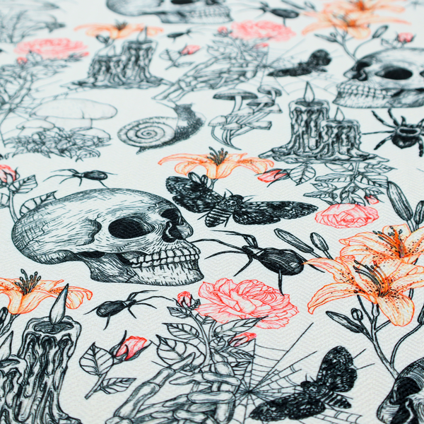 A hand-drawn, sketch-style pattern on an off-white background featuring human skulls, melting candles, spiders, moths, mushrooms, and floral elements like lilies and roses.