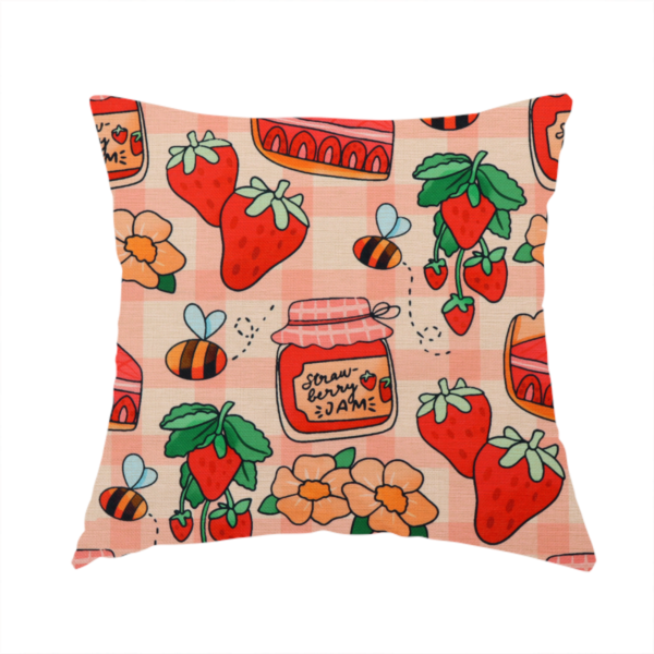 The fabric used to create this handmade cushion is a charming, whimsical repeating pattern featuring strawberry-themed motifs—including jars labelled "Strawberry Jam," slices of cake topped with strawberries, fresh strawberries on the vine, orange flowers, and buzzing bees—set against a pink and white gingham background.