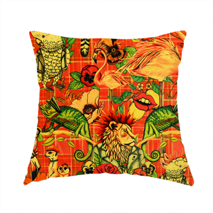 The fabric used to create this handmade cushion is a busy, maximalist vintage-style fabric featuring a vibrant orange plaid background densely patterned with rock-and-roll animals in leather jackets and punk-inspired motifs, including cockatoos, flamingos, chameleons, a lion with a mohawk, meerkats, and lemurs intertwined with large flowers like poppies and pansies.
